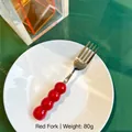 Creative stainless steel dining fork with red spherical ceramic handle and 18cm length - Fork / Red