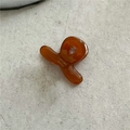 Detailed view of an amber acetate hair claw clip with golden Sunshine Handmade text - Brown (Mini Cross)