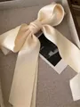 Elegant cream satin bow hair clip with a smooth silk finish for women's hairstyles - Cream