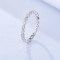 Macro shot of silver eternity ring featuring a rhombus pattern of clear zircon stones - US 5 / White Gold