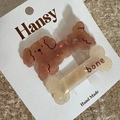 Detail of cute brown poodle and beige bone hair clips on a white brand display card - 2-Pack Cartoon - Brown Dog