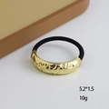 Elastic hair tie with a textured gold geometric metal accent in a minimalist style - Large Single-Tube Wave Gold