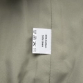Detail shot of the garment label showing 45% cotton and 55% linen fabric composition - 45% Cotton 55% Linen