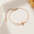 Bracciale in oro rosa con ciondolo a cilindro e anelli con numeri romani eleganti - Oro rosa