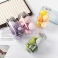 Four jars of colorful makeup sponges in teardrop and slanted shapes with silver lids - Chubby Bottles [4 Large 3 Small 7 Bottles]