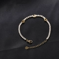 Titanium steel bracelet featuring a gold finish with star and moon pendants and white stones - Gold Moon Star