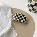 Detail of checkered black and white hair claw clip with smooth acetic texture - Small Irregular Semicircle