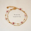 Detailansicht eines goldenen Doppelarmbands mit rosa Perlen und S.steel-Punze auf Anhänger - Rhodochrosit Armband