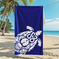 Blue double-sided velvet beach towel with white sea turtle design hanging on a tropical beach - B108-White Turtle Tribal Texture