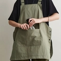 Japanese work apron in army green fabric with adjustable cross-back straps and pockets - Army Green