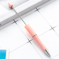 Pink DIY beadable ballpoint pen with a telescopic metal rod and sleek plastic handle - Macaron Rouge Pink