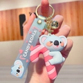 Porte-clés koala bleu en PVC avec sucre d'orge rose et dragonne assortie - Koala - Sucre d'orge