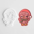 Penguin shaped Christmas cookie cutter with a decorated penguin biscuit in festive attire - Christmas Penguin B