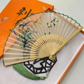 Handmade silk folding fan with blue floral embroidery, bamboo ribs and green tassel - Elegant Orchid Pattern
