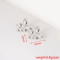 Detailed size chart showing silver butterfly earrings measuring 25mm by 24mm at 6.8g - Butterfly Texture (26#)