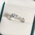 Macro shot of silver adjustable ring with enamel flower and pearls on green velvet box - Asymmetric Enamel Artificial Pearl (White Gold Tone 8)