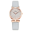 Women's rose gold watch with leaf pattern dial and grey leather strap with bow charm - Blue