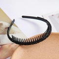 Close-up of thin black rhinestone headband with non-slip inner teeth and sparkling finish - Black