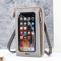 Grey touchscreen phone crossbody bag with adjustable strap and golden zipper detail - Gray