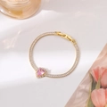 Detail of gold bracelet with sparkling pink heart gemstone and pavé cubic zirconia - Gold Pave Setting Style