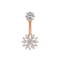 Macro shot of rose gold belly piercing ring with sparkling white zircon floral design - Snowflake / Rose Gold
