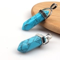 Hexagonal turquoise pendant with silver metal clasp on a natural wood coaster base - Blue Turquoise