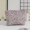 Detailed view of floral quilted makeup bag with red flower pattern and metal zipper - Large Capacity / Red Floral