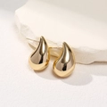 Chic gold teardrop stud earrings with polished mirror finish on white stone background - Small Gold