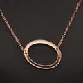 Elegant rose gold oval hollow pendant necklace with refined cross chain design - Rose Gold O