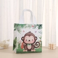 Reusable non-woven gift bag with cute cartoon monkey print on a minimalist table - 2010-4 Monkey / 23*22*11cm