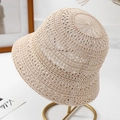 Close-up of beige knit sun hat showing breathable hollow-out crochet pattern detail - One Size / Beige
