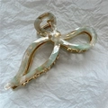 Macro detail of acetate bow hair claw clip showing marble green texture and golden spring - 4# Grey Green