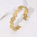 Bracciale rigido dorato a farfalla in acciaio inossidabile con texture spazzolata - Oro