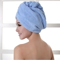 Blue microfiber hair drying towel cap worn by a model for fast water absorption - 60*25cm 70g / Blue