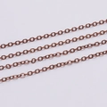 Macro shot of 1.6mm antique copper curb chain links for DIY body jewelry making - Antique Red Copper