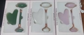 Three rose quartz jade roller and gua sha sets in pink, white, and green packaging - Glass Style