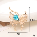 Accessorio farfalla dorata con gemme blu e pietre occhio di gatto rosa di 4x5,5 cm - D099-Farfalla Goccia d'acqua Blu