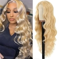Detail view of long wavy blonde synthetic wig with natural gradient and volume - Gold