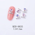 Macro shot of MZH-8835 heart-shaped nail charm with pink jewel and silver base 7.5mm - Starry Pink Red (8835)