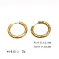 Detail view of hammered gold hoop earrings showing 12mm diameter and 2.5mm wire gauge - Gold / Hammered Texture