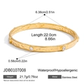 Detailed view of gold stainless steel bangle with hammered texture and inset crystals - Gold Hammered Zircon