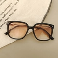 Detail view of retro square kids sunglasses with black frames and UV400 gradient lenses - Black Frame Gradient Tea