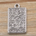 Silver zinc alloy tarot pendant featuring The Star design on a light wood background - The Star-Antique Silver