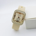 Detailed close-up of a square quartz watch with cream silicone strap and gold dial texture - Yellow Number Style