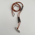 Macro shot of a silver pea pod pendant on a brown leather cord with woven details - Style 96# Necklace / Coffee-Silver