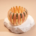 Detail of pink marble resin and gold metal blocks on a stretch beaded wide bracelet - Pink