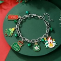 Detail of Christmas charm bracelet with silver bells, tree and snowman charms - D1246 (Silver Christmas Sign)