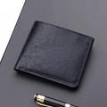 Classic black bifold leather wallet with lychee texture and business pen on grey background - Black