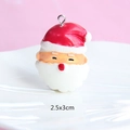 Detail shot of a red and white resin Santa Claus charm with 2.5x3cm dimensions - Style 20-Santa Claus Head