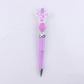 Detailed view of DIY purple beaded pen with cartoon cow head and silicone charms - Purple